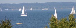 Segelboote und Stellplätze, © Chiemsee Camping